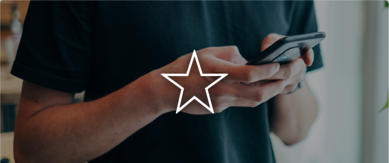 A person holding a smartphone overlayed by an illustration of a star
